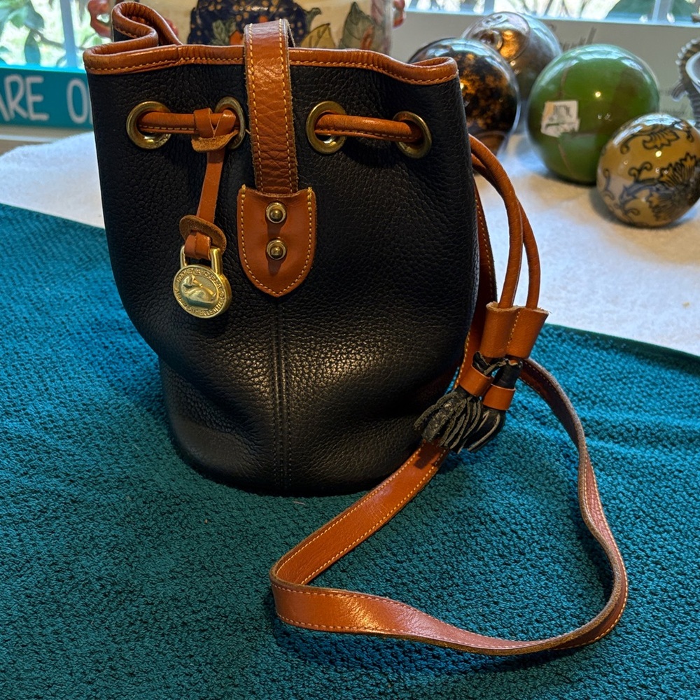 Dooney and Bourke Navy and Brown Pebble Leather Drawstring Bucket Bag